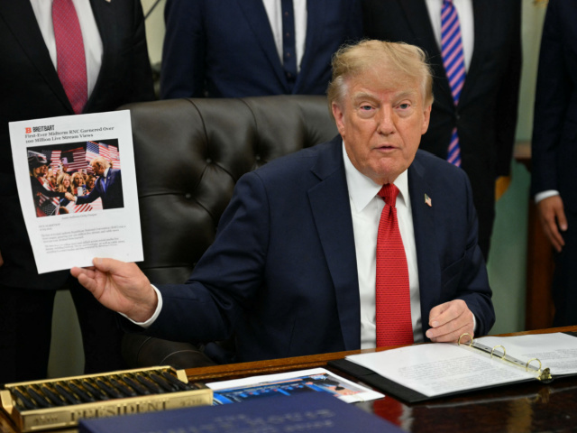 Trump holds up breitbart article